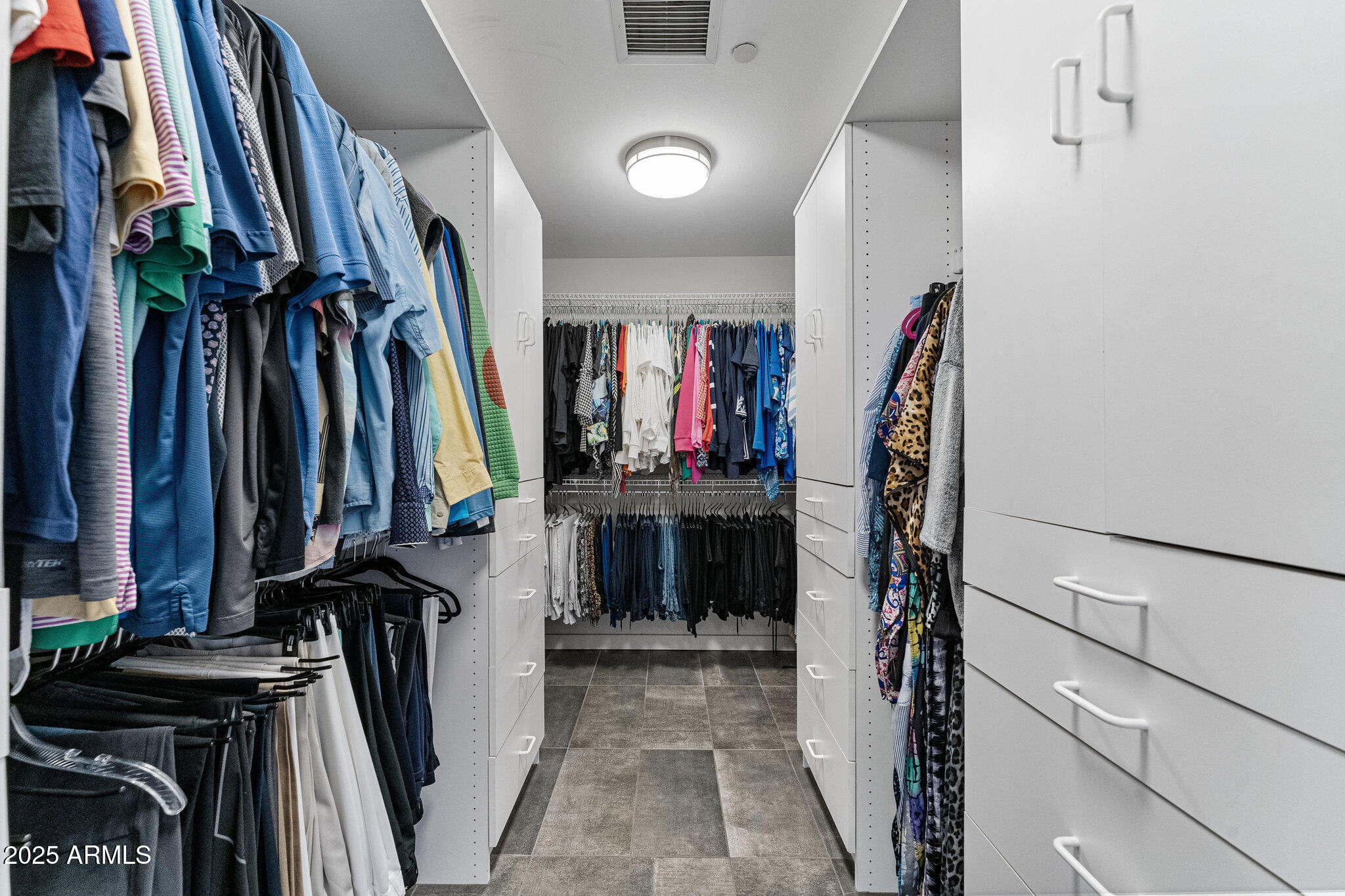 1040 East Osborn Road, Unit 1103 Phoenix, AZ 85014 - Photo 29 of 49 a view of walk in closet with clothes