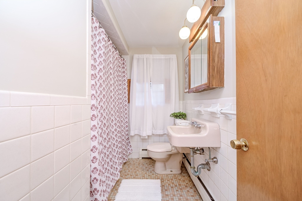 32 Staaf Road Saugus, MA 01906 - Photo 11 of 17 a bathroom with a sink toilet and shower