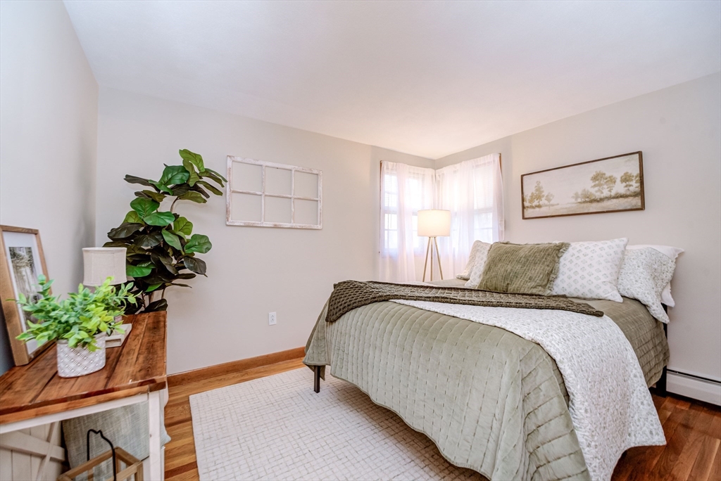 32 Staaf Road Saugus, MA 01906 - Photo 12 of 17 a bedroom with a bed and a potted plant
