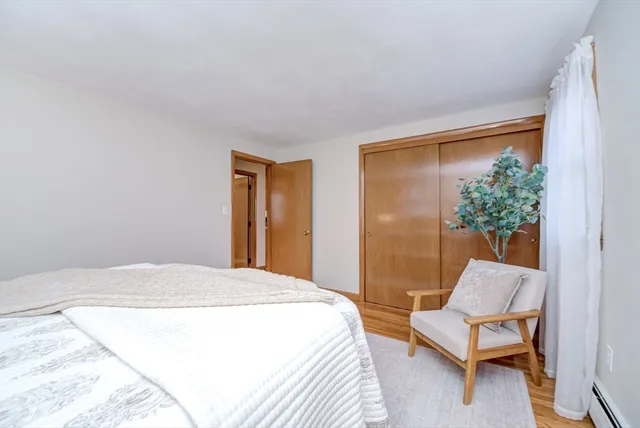 a bedroom with a bed and a chair