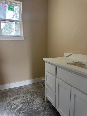 a bathroom with a sink and vanity