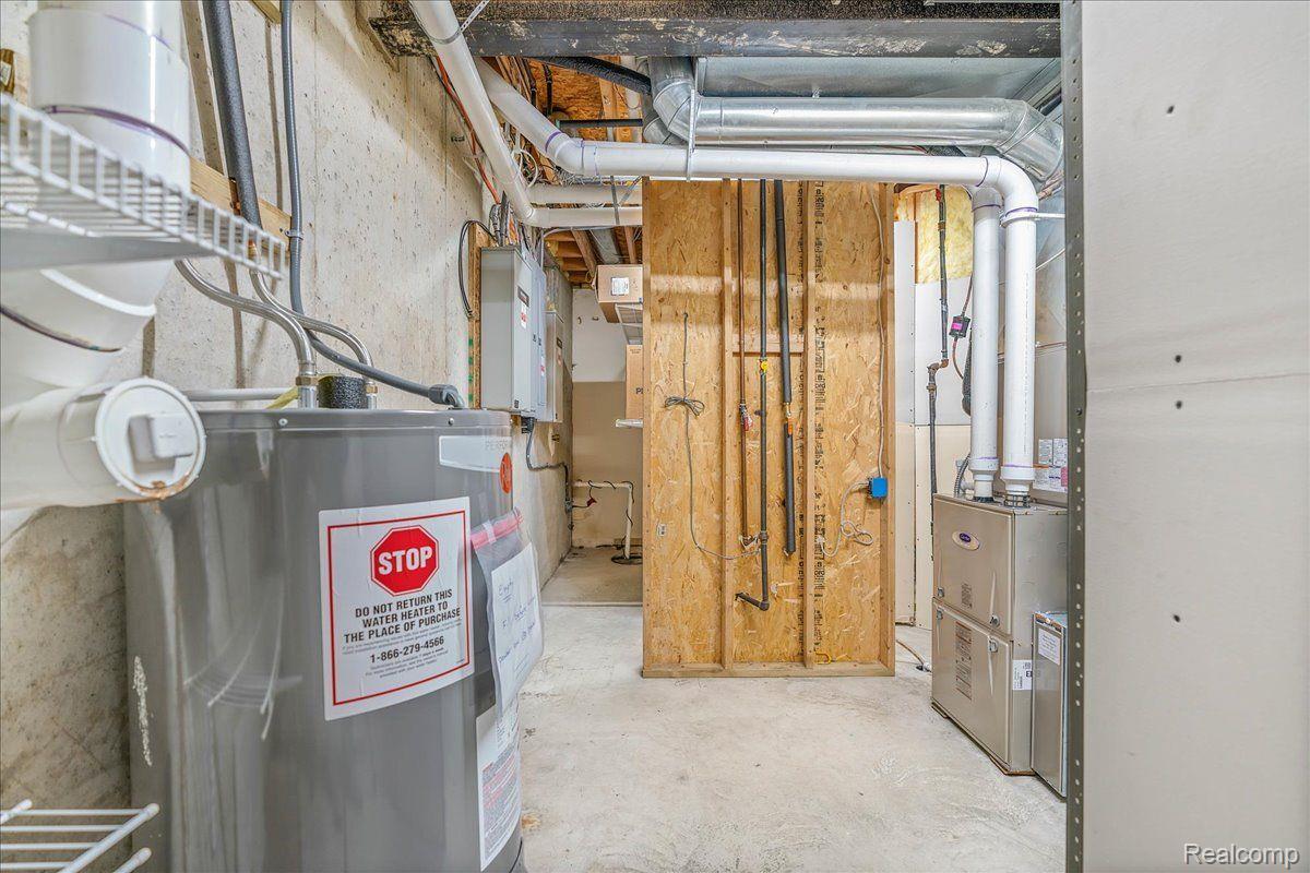 21851 Prince Road Belleville, MI 48111 - Photo 44 of 59 Utility room in basement w backup elec. WH