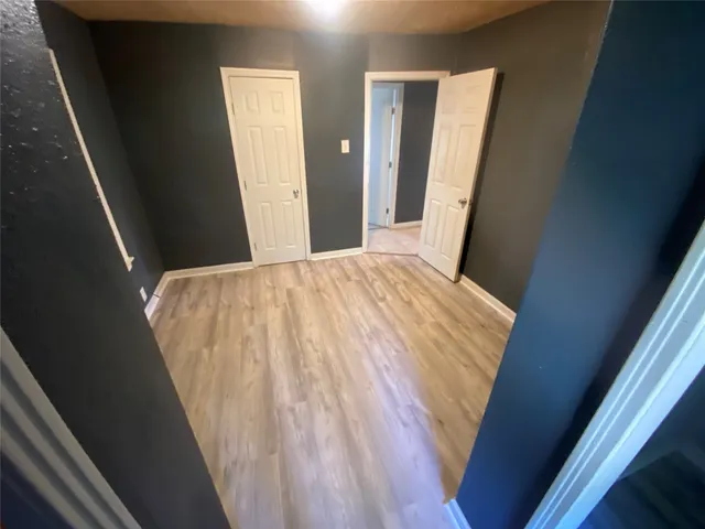 a bathroom with a sink and mirror with toilet