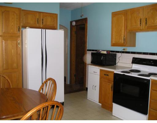 38 Fresno Street Springfield, MA 01104 - Photo 4 of 10 a kitchen with stainless steel appliances a refrigerator a stove a sink a dining table and chairs