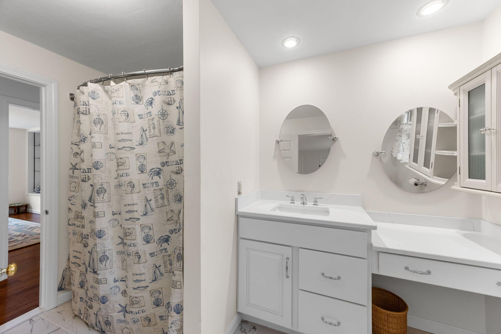 407 Orleans Road, Unit D North Chatham, MA 02650 - Photo 16 of 36 a bathroom with a sink and a mirror