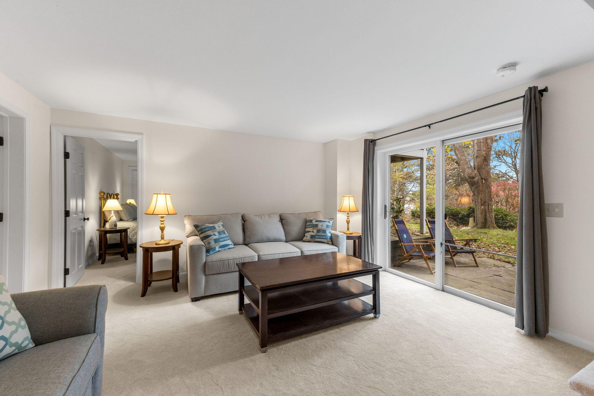 407 Orleans Road, Unit D North Chatham, MA 02650 - Photo 19 of 36 a living room with furniture and a lamp