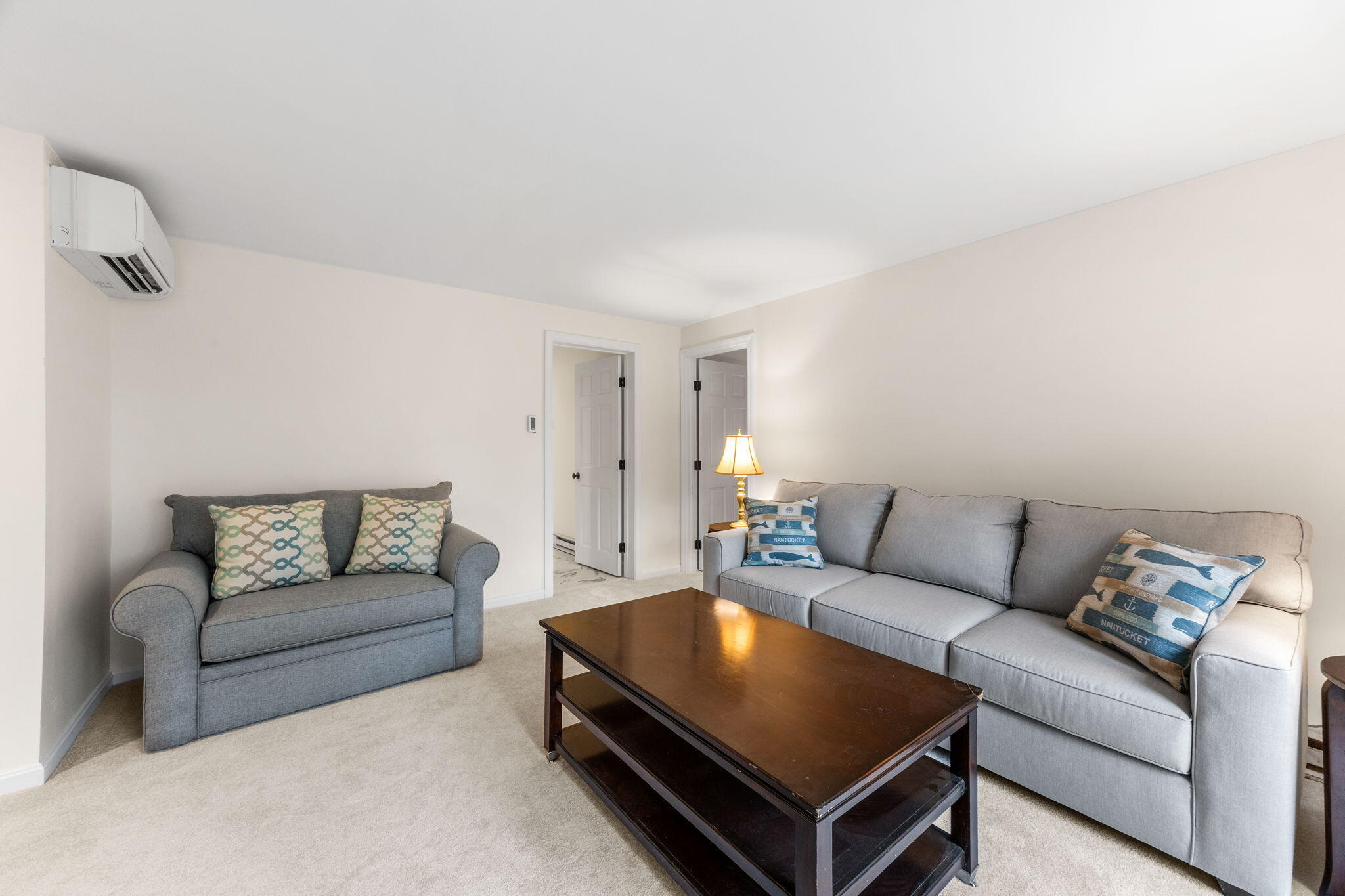 407 Orleans Road, Unit D North Chatham, MA 02650 - Photo 20 of 36 a living room with furniture and a couch