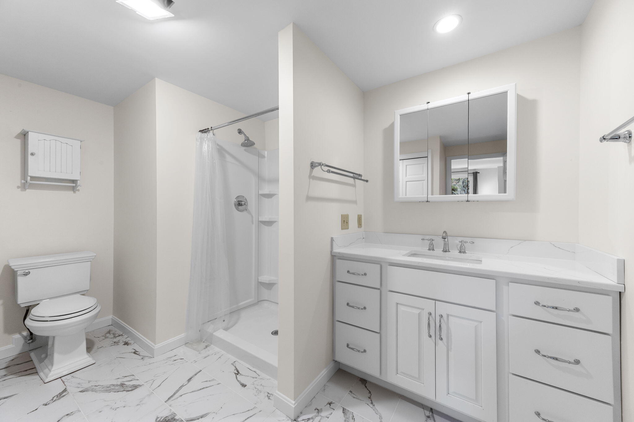 407 Orleans Road, Unit D North Chatham, MA 02650 - Photo 21 of 36 a bathroom with a toilet sink and shower