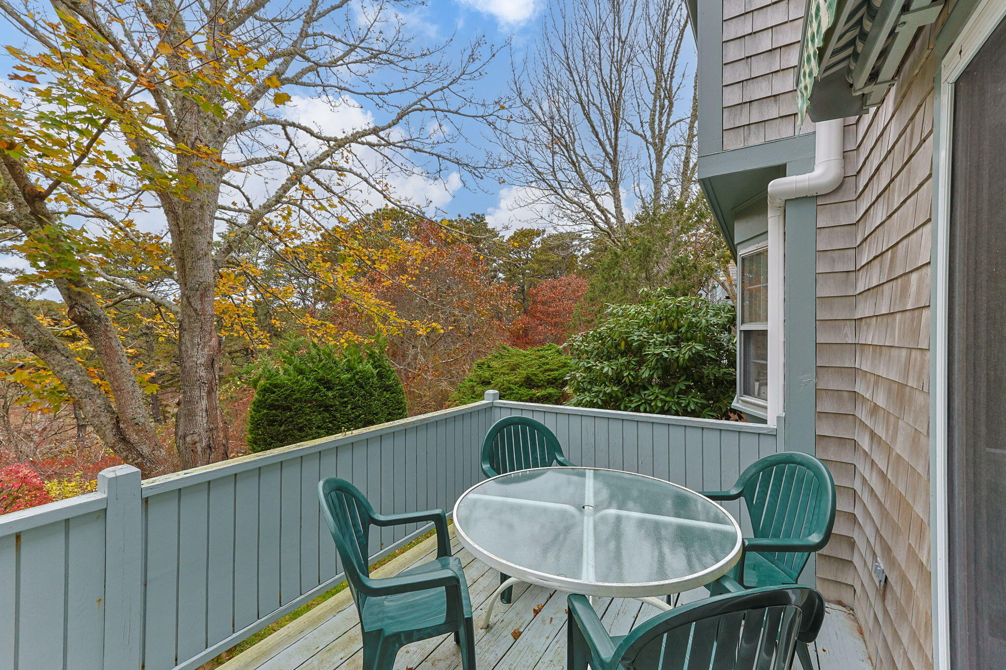407 Orleans Road, Unit D North Chatham, MA 02650 - Photo 24 of 36 a view of a chair and table in the balcony