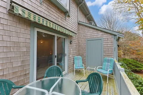 a view of balcony with two chairs and table
