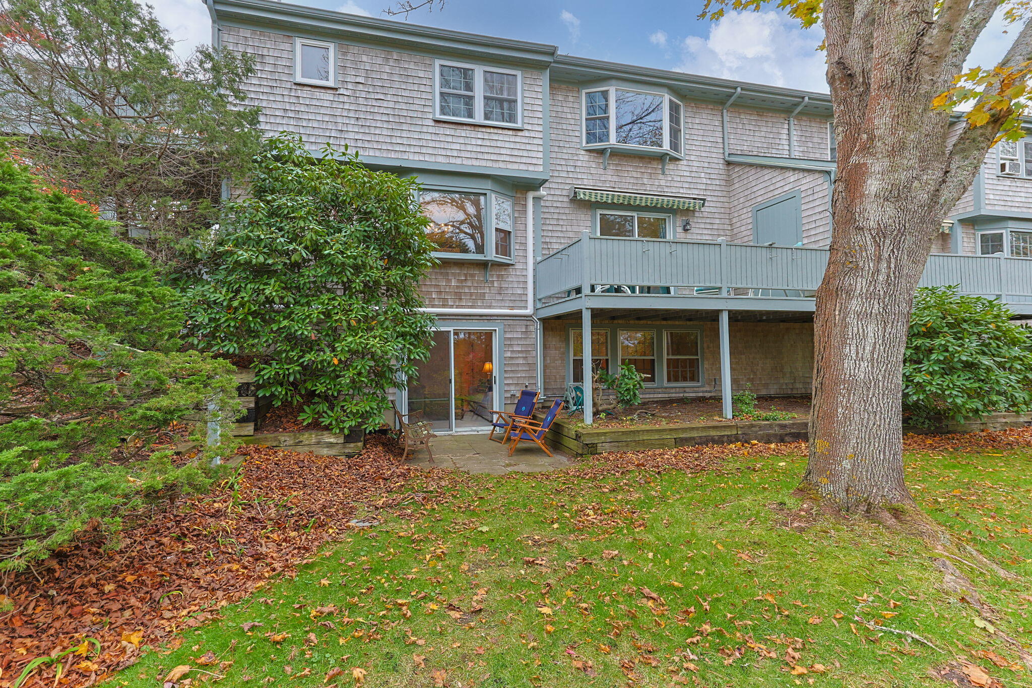 407 Orleans Road, Unit D North Chatham, MA 02650 - Photo 26 of 36 a front view of a house with a yard