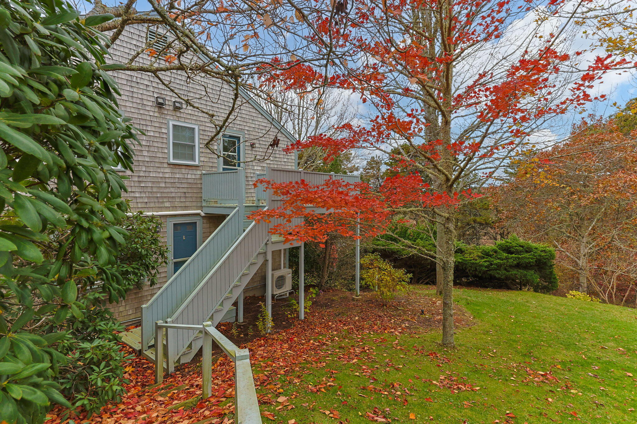 407 Orleans Road, Unit D North Chatham, MA 02650 - Photo 31 of 36 a backyard of a house with table and chairs