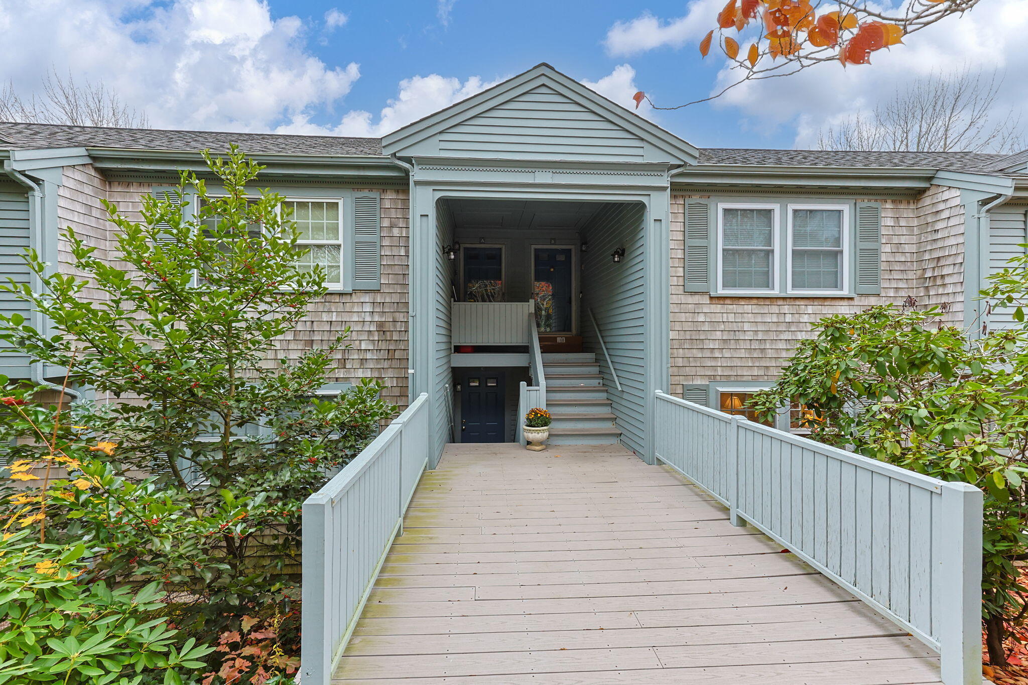 407 Orleans Road, Unit D North Chatham, MA 02650 - Photo 34 of 36 a view of a balcony with wooden floor and a potted plant