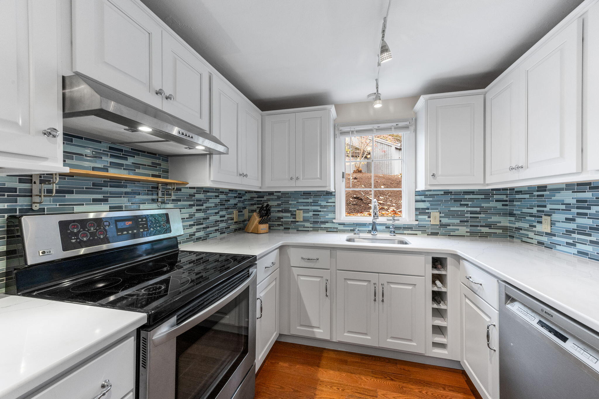 407 Orleans Road, Unit D North Chatham, MA 02650 - Photo 9 of 36 a kitchen with a sink stove and cabinets
