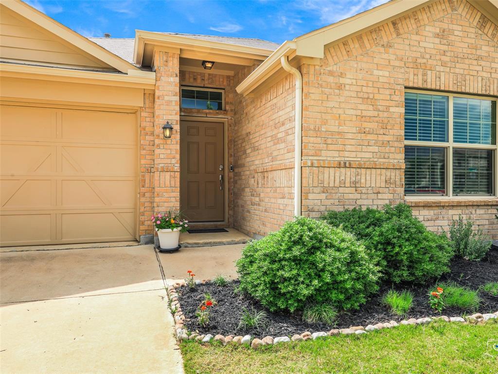 4517 Ashmark Road Aubrey, TX 76227 - Photo 3 of 26 a front view of a house with a yard