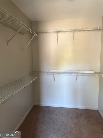 a view of a room with racks on the wall