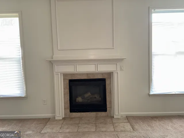 a living room with a fireplace