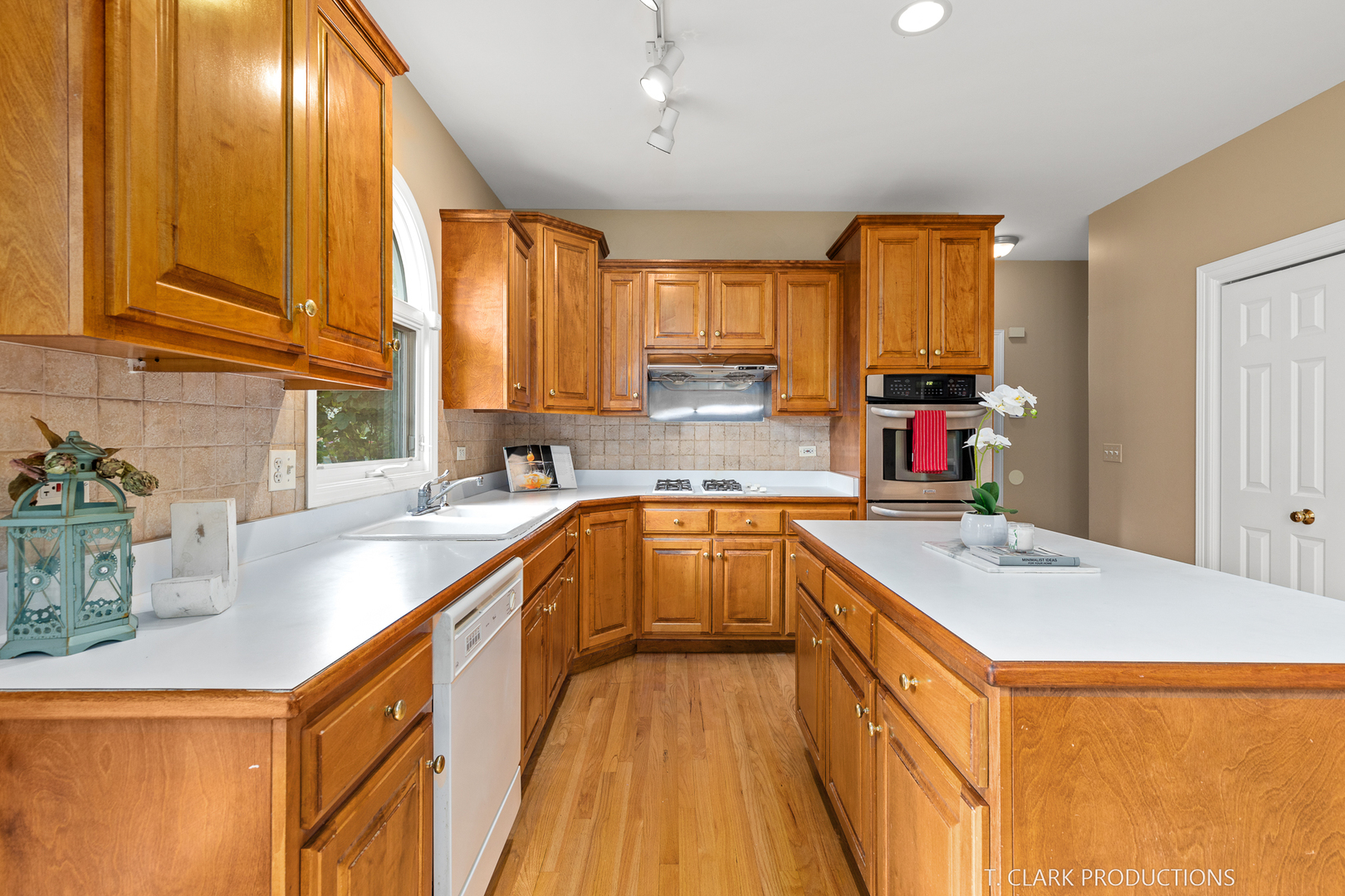 2724 Wait Road Naperville, IL 60564 - Photo 9 of 24 a kitchen with a sink a counter top space cabinets and a large window
