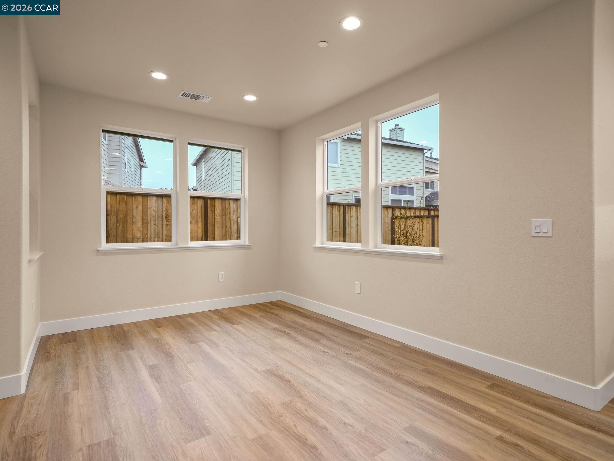 3030 Byron Road Tracy, CA 95377 - Photo 12 of 58 a view of empty room with wooden floor and fan