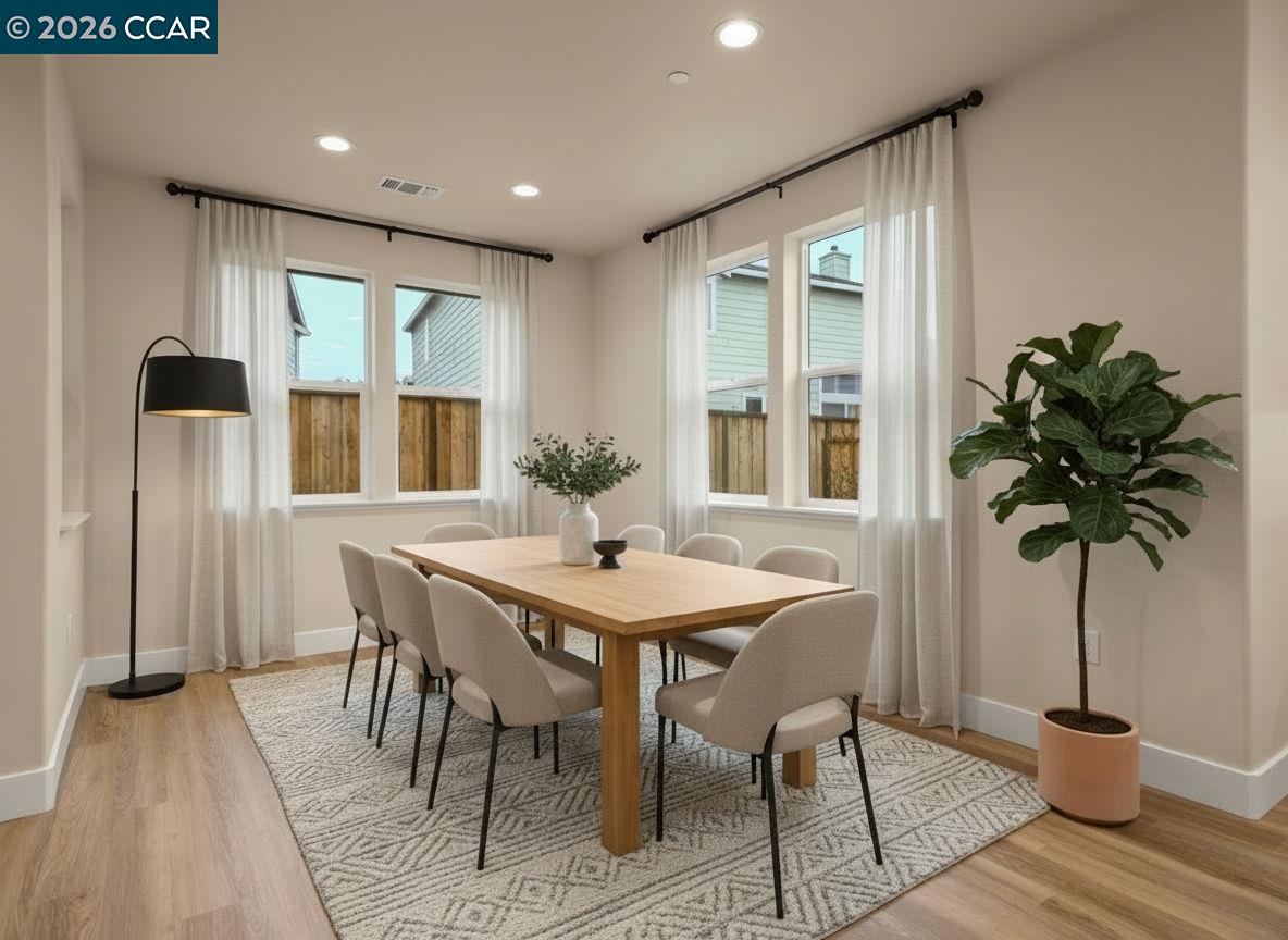 3030 Byron Road Tracy, CA 95377 - Photo 13 of 58 a view of a dining room with furniture window and wooden floor