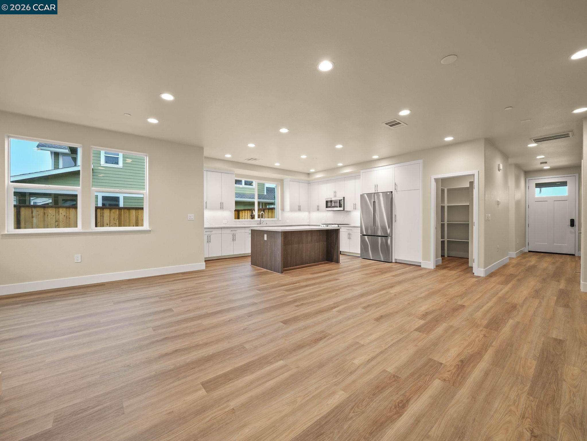 3030 Byron Road Tracy, CA 95377 - Photo 15 of 58 a view of an empty room with wooden floor and a window