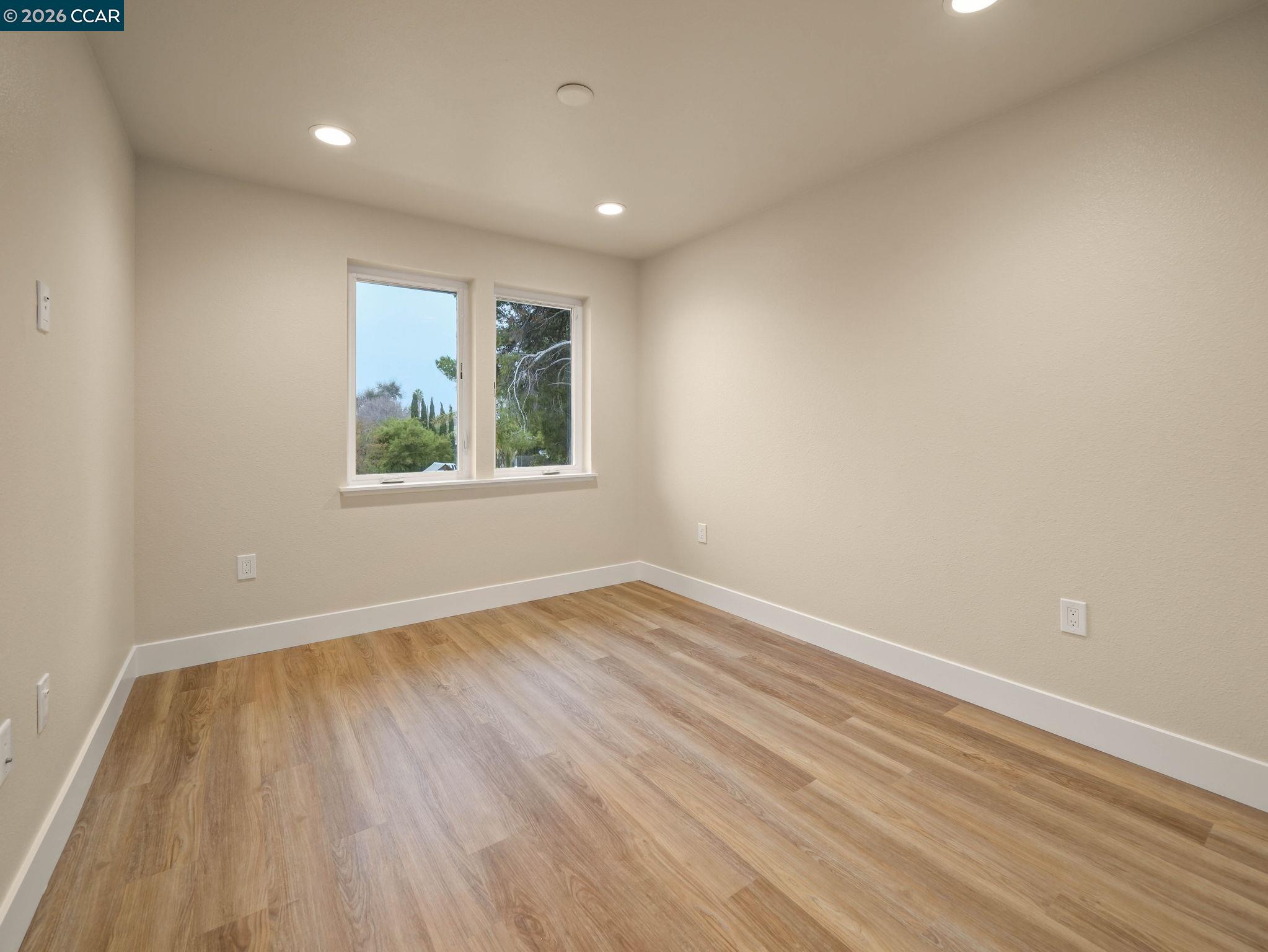 3030 Byron Road Tracy, CA 95377 - Photo 20 of 58 wooden floor in an empty room with a window