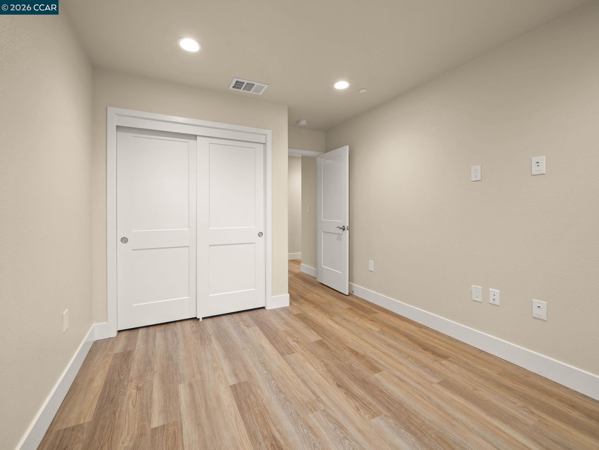 3030 Byron Road Tracy, CA 95377 - Photo 21 of 58 a view of an empty room with wooden floor