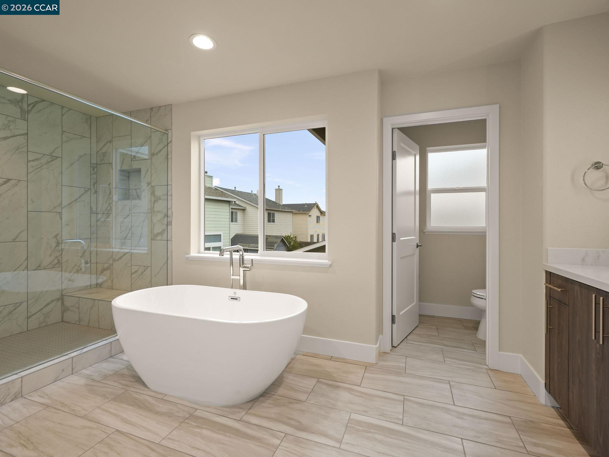 3030 Byron Road Tracy, CA 95377 - Photo 29 of 58 a view of a bathroom with a tub and shower
