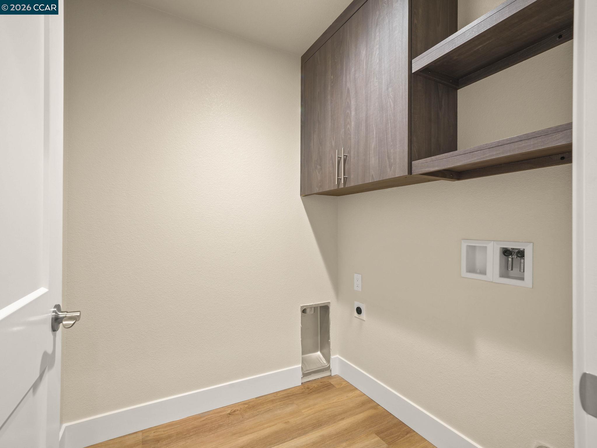 3030 Byron Road Tracy, CA 95377 - Photo 33 of 58 a view of a room with wooden floor and cabinet