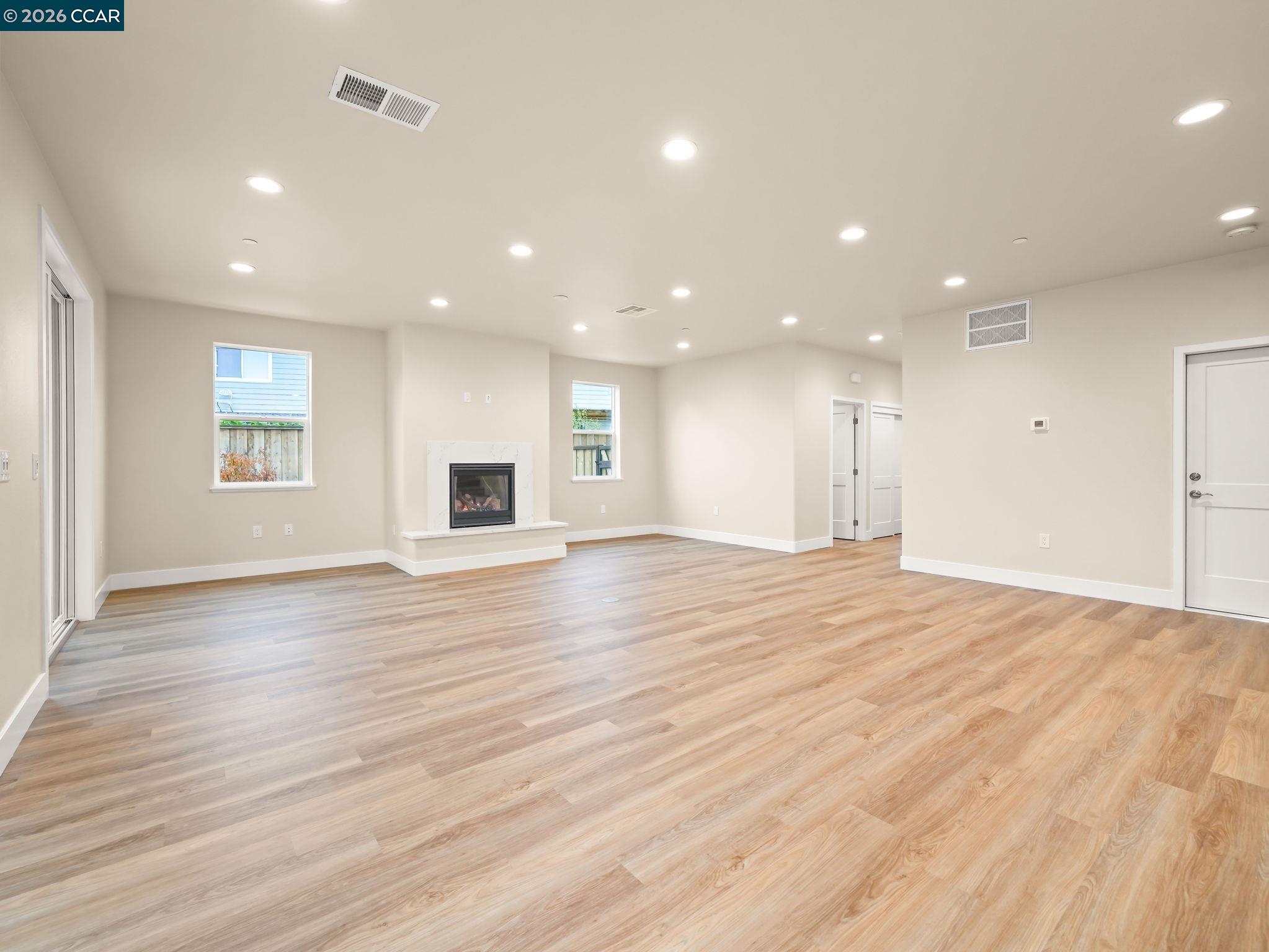 3030 Byron Road Tracy, CA 95377 - Photo 48 of 58 an empty room with wooden floor and windows