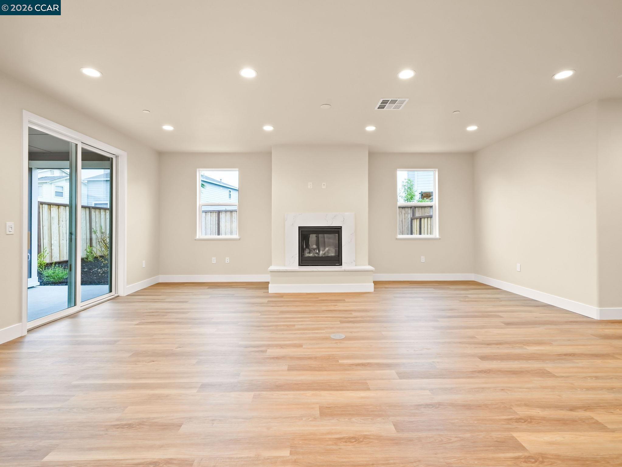 3030 Byron Road Tracy, CA 95377 - Photo 49 of 58 an empty room with wooden floor and windows