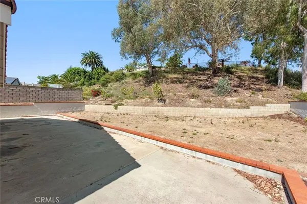 a view of a yard with snow on the road