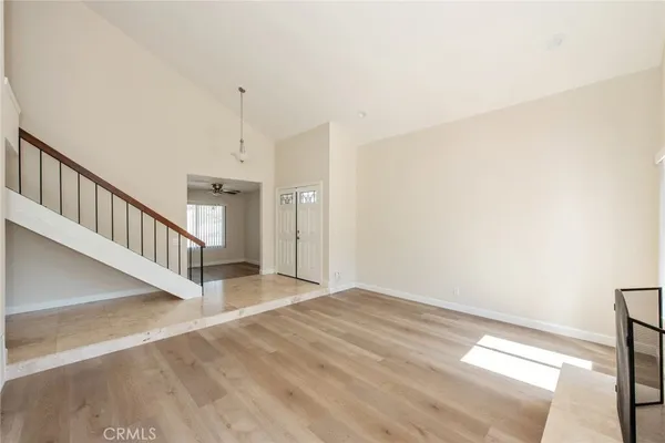 a view of an entryway with wooden floor