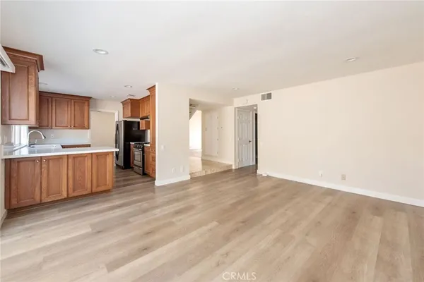 a view of kitchen with wooden floor