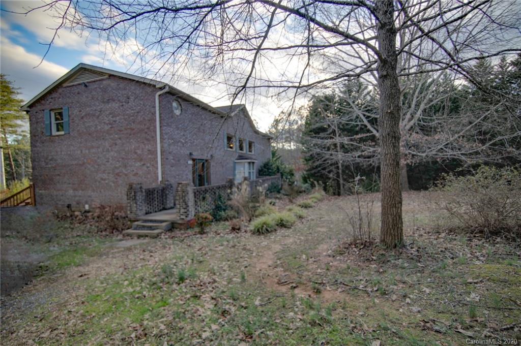 268 Painter Road Mill Spring, NC 28756 - Photo 2 of 41 a backyard of a house with lots of green space