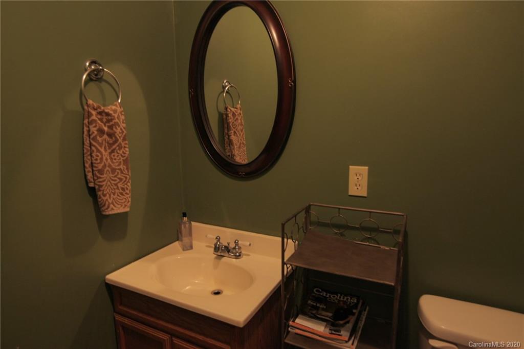 268 Painter Road Mill Spring, NC 28756 - Photo 13 of 41 a bathroom with a sink and a mirror