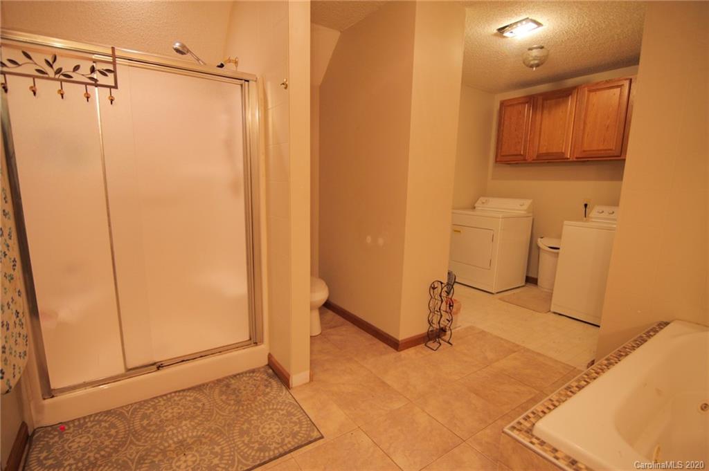 268 Painter Road Mill Spring, NC 28756 - Photo 18 of 41 a bathroom with a shower and a sink