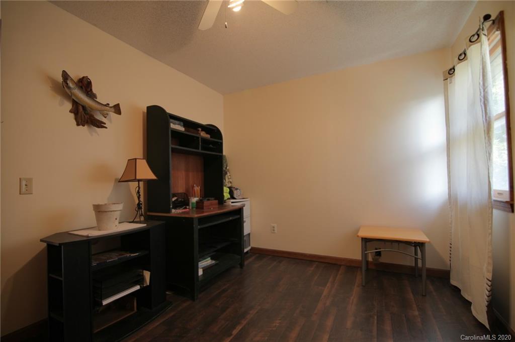 268 Painter Road Mill Spring, NC 28756 - Photo 24 of 41 a room with furniture and wooden floor