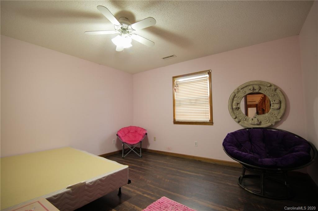 268 Painter Road Mill Spring, NC 28756 - Photo 27 of 41 a view of a room with a table and a chandelier
