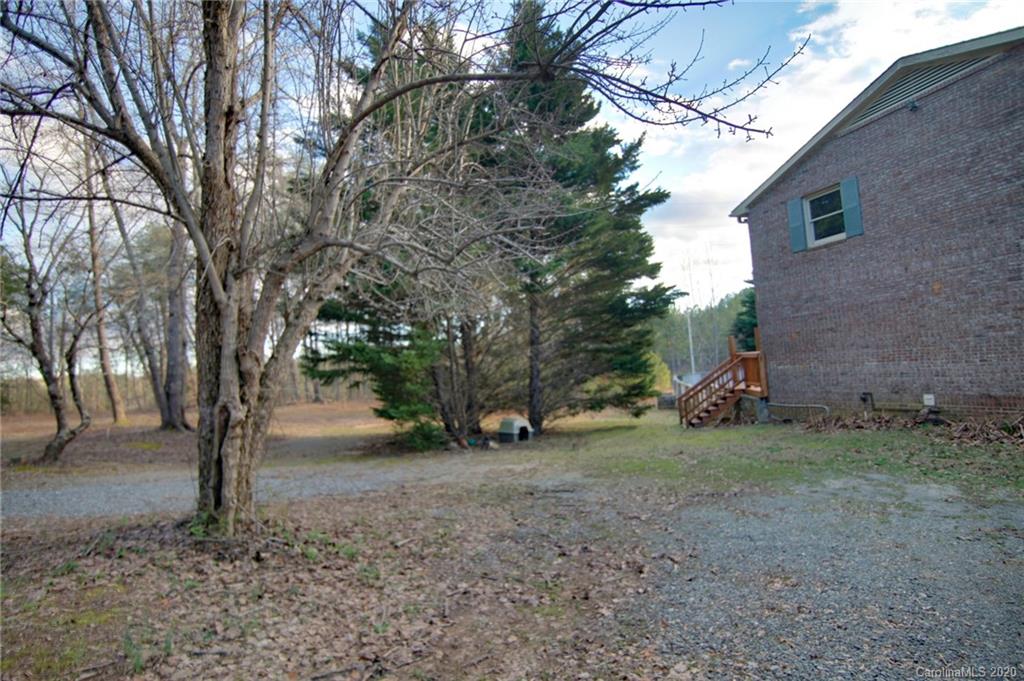 268 Painter Road Mill Spring, NC 28756 - Photo 4 of 41 a view of some trees in the backyard