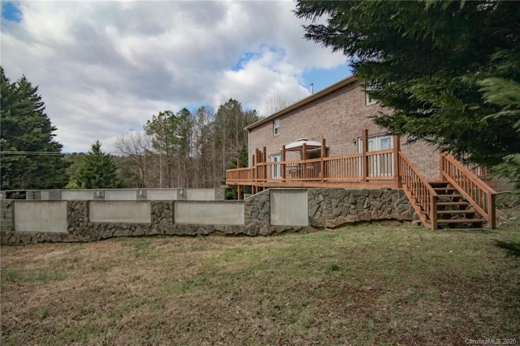 268 Painter Road Mill Spring, NC 28756 - Photo 33 of 41 a view of a house with a yard