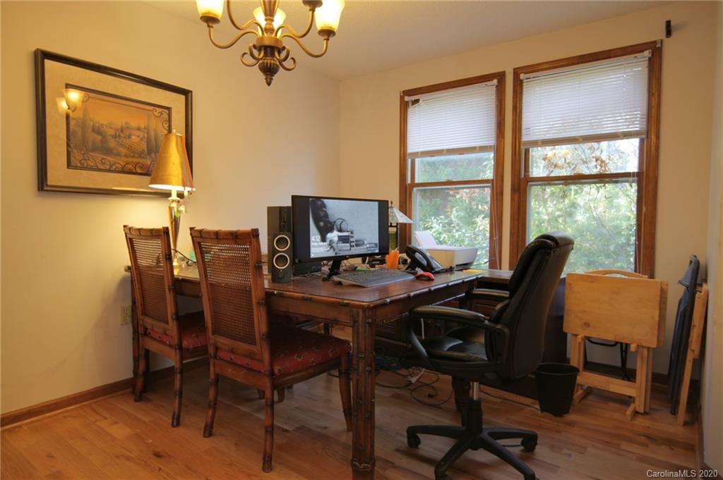 268 Painter Road Mill Spring, NC 28756 - Photo 10 of 41 a view of a workspace with furniture and a window