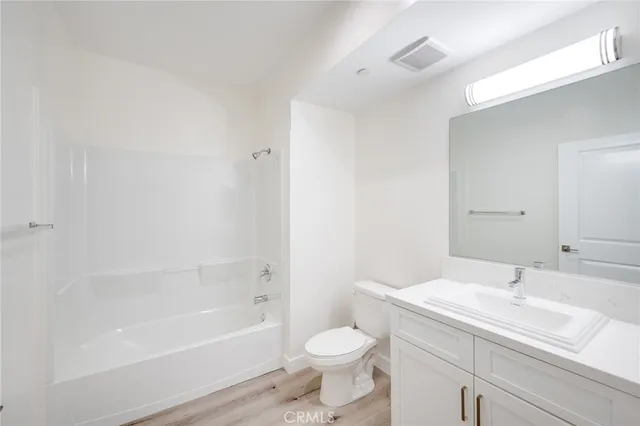 a bathroom with a sink toilet and bathtub