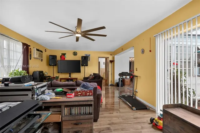 a room with furniture or wooden floor and a window