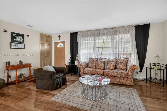 a living room with furniture and a window