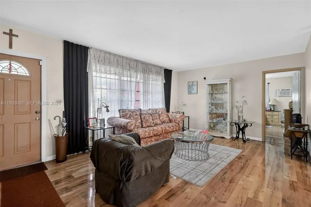 a living room with furniture and a window