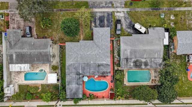 an aerial view of a house with outdoor space