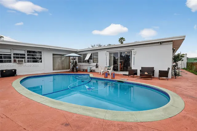 a outdoor space with lots of tables and chairs