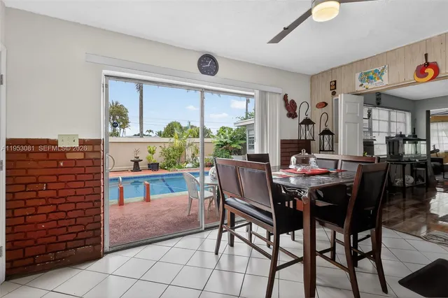 a view of a dining room with furniture window and outside view