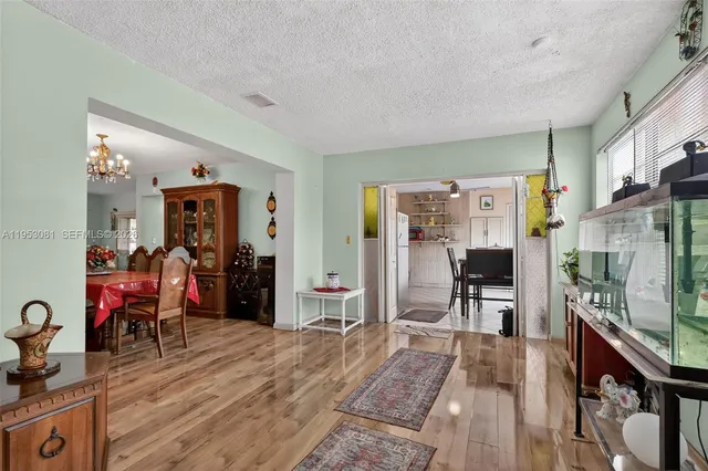 a view of a livingroom with furniture and gym equipment